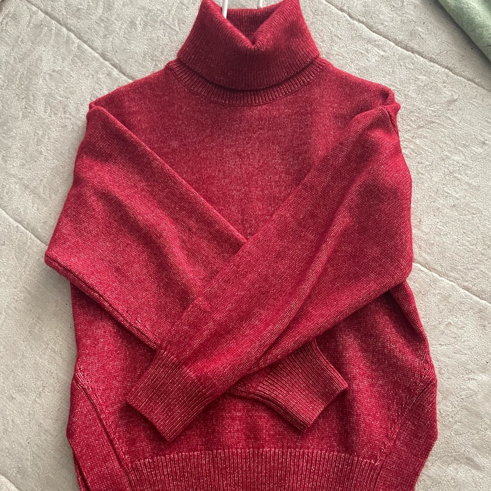 Lovely colour, oversized with subtle slit on each side.